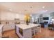 Modern kitchen with white cabinets and large island at 512 W Franklin St, Zebulon, NC 27597