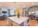 Open kitchen with large island, overlooking living room at 512 W Franklin St, Zebulon, NC 27597