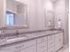 Bathroom with granite countertops and double sinks at 512 W Franklin St, Zebulon, NC 27597