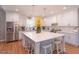 White kitchen with stainless steel appliances and island at 512 W Franklin St, Zebulon, NC 27597
