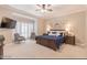 Main bedroom with king-size bed and plenty of natural light at 512 W Franklin St, Zebulon, NC 27597