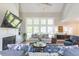 Living room featuring a large TV and comfortable seating at 512 W Franklin St, Zebulon, NC 27597