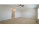 Large bedroom with carpet, ceiling fan, and access to bathroom at 1121 Consortium Dr # 110, Raleigh, NC 27603