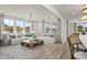 Bright living room features hardwood floors, comfy sofas, and large windows at 3158 Alden Way, Angier, NC 27501