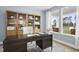 Spacious home office with built-in shelves and large windows at 3158 Alden Way, Angier, NC 27501