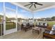 Relaxing screened porch with wooden furniture and view of neighborhood at 3158 Alden Way, Angier, NC 27501