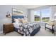 Serene bedroom with floral bedding and large windows at 3158 Alden Way, Angier, NC 27501