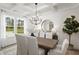 Elegant dining room with hardwood floors, chandelier, and large windows at 3158 Alden Way, Angier, NC 27501