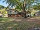 Large backyard with mature trees and spacious grassy area at 3704 Huntleigh Dr, Raleigh, NC 27604