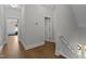 Bright hallway with hardwood floors and access to bedrooms at 409 Rogers Rd, Zebulon, NC 27597