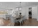 Kitchen dining area with farmhouse table and white chairs at 409 Rogers Rd, Zebulon, NC 27597