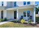Front porch detail with rocking chairs and landscaping at 3010 Garner Rd # 101, Raleigh, NC 27610