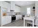 Modern kitchen featuring white cabinets, stainless steel appliances, and quartz countertops at 3010 Garner Rd # 101, Raleigh, NC 27610
