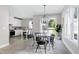 Bright dining room with white table and access to backyard at 3010 Garner Rd # 101, Raleigh, NC 27610