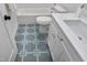 Bathroom with a bathtub, toilet and patterned tile floor at 3010 Garner Rd # 101, Raleigh, NC 27610