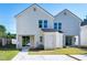 Rear view of a two-story house with a patio, storage shed, and parking area at 3010 Garner Rd # 101, Raleigh, NC 27610