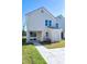 Back of house showing a sliding glass door to a patio and a detached storage unit at 3010 Garner Rd # 101, Raleigh, NC 27610