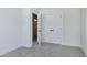 Bedroom with carpet flooring and a double door closet at 3010 Garner Rd # 101, Raleigh, NC 27610