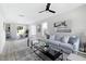 Open living area with gray sofa and view of dining area at 3010 Garner Rd # 101, Raleigh, NC 27610