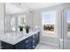 Elegant bathroom with double vanity, marble flooring, and a large mirror at 3010 Garner Rd # 101, Raleigh, NC 27610