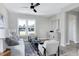 Open living room with gray sofa and access to dining area at 3010 Garner Rd # 101, Raleigh, NC 27610