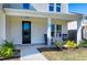 Front porch with rocking chairs and view of front yard at 3010 Garner Rd # 101, Raleigh, NC 27610