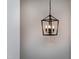 Black, four-light hanging fixture with cage design at 3010 Garner Rd # 101, Raleigh, NC 27610