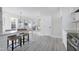 Open concept kitchen features island seating and stainless steel appliances at 3010 Garner Rd # 101, Raleigh, NC 27610