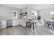 Modern kitchen with white cabinets, stainless steel appliances, and an island with seating at 3010 Garner Rd # 101, Raleigh, NC 27610
