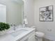 Modern bathroom with white vanity and a contemporary mirror at 3010 Garner Rd # 101, Raleigh, NC 27610