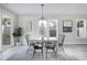 Bright dining area with a table, four chairs, and large windows at 3010 Garner Rd # 101, Raleigh, NC 27610