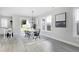 Dining area with white table and black chairs, near kitchen at 3010 Garner Rd # 101, Raleigh, NC 27610