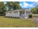 House exterior with screened porch and landscaping at 3440 Apache Dr, Raleigh, NC 27609