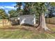 Backyard with shed, large tree, and wooden fence at 3440 Apache Dr, Raleigh, NC 27609