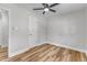 Light and airy bedroom featuring wood-look floors and a closet at 3440 Apache Dr, Raleigh, NC 27609