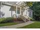 Gray house exterior with a welcoming front porch at 137 Summit Oaks Ln, Holly Springs, NC 27540