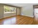 Bright living room featuring hardwood floors and large windows at 414 Ward St, Graham, NC 27253