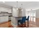 Kitchen with an island, stainless steel appliances, and hardwood floors at 222 Glenwood Ave # 508, Raleigh, NC 27603