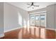 Bright living room with hardwood floors and access to a private balcony at 222 Glenwood Ave # 508, Raleigh, NC 27603