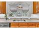 Kitchen features a double sink and a view into the living room at 3721 Old Post Rd, Raleigh, NC 27612