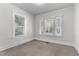 Bedroom with neutral carpeting and large windows at 810 E Edenton St, Raleigh, NC 27601