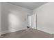 Spacious bedroom with neutral carpeting and access to hallway at 810 E Edenton St, Raleigh, NC 27601
