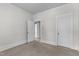 Bedroom with neutral carpeting and access to other rooms at 810 E Edenton St, Raleigh, NC 27601