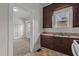 View into kitchen with dark cabinets and a sink at 810 E Edenton St, Raleigh, NC 27601