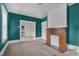 Living room featuring a brick fireplace and teal colored walls at 810 E Edenton St, Raleigh, NC 27601