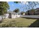 Spacious backyard with a white fence and mature trees at 810 E Edenton St, Raleigh, NC 27601