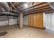 Unfinished basement with exposed brick and wooden walls at 810 E Edenton St, Raleigh, NC 27601