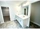 Double vanity bathroom with walk-in shower and tile floor at 333 Hopewell Branch Ct, Smithfield, NC 27577