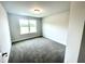 Well-lit bedroom featuring a window and carpeted floor at 333 Hopewell Branch Ct, Smithfield, NC 27577