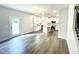 Open kitchen with island, stainless steel appliances, and hardwood floors at 333 Hopewell Branch Ct, Smithfield, NC 27577